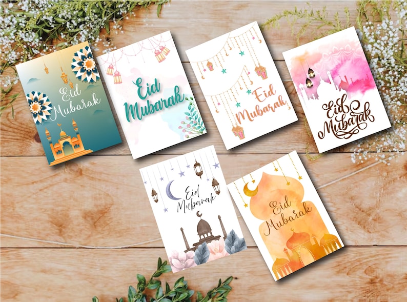 May include: Six different greeting cards with watercolor designs and the text "Eid Mubarak" in various styles. The cards feature a variety of colors, including pink, blue, green, and orange.