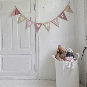 Custom cotton fabric bunting banner with individual name on garland text phrase triangles Connie girl for bedrrom 1st birthday party celebration girlande banderole wimpelkette made to order reusable white letters bedroom bed gift idea newborn shower