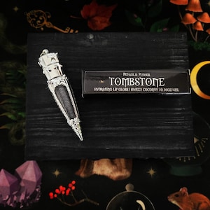 Tombstone Lip Gloss | sweet coconut | gunmetal | witchy makeup | witchy lip gloss | goth makeup | vegan and cruelty-free