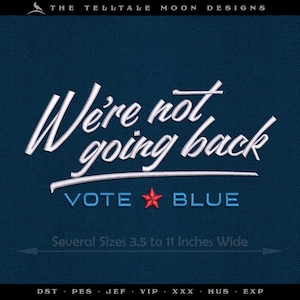 May include: Dark blue embroidered design with the text "We're not going back" in white script. Below, "VOTE BLUE" is displayed with a red star. The design is available in several sizes, ranging from 3.5 to 11 inches wide.
