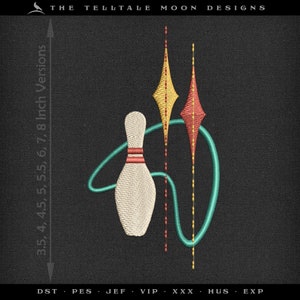 May include: A white bowling pin with red stripes is surrounded by a teal blue and yellow design. The design includes two diamond shapes with red and yellow stitching. The image includes the text "THE TELLTALE MOON DESIGNS" and "DST PES JEF VIP XXX HUS EXP".