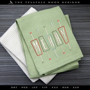May include: Two green kitchen towels with a white towel underneath. The green towels have a red, white, and green embroidered design that says "MERRY" in a retro style.