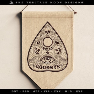 May include: A beige banner featuring a dark brown Ouija board design. The board includes the words "HELLO" and "GOODBYE", alongside other symbols. The banner is suspended from a wooden rod.