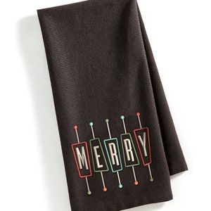 May include: Black kitchen towel with the word "MERRY" spelled out in colorful, retro-style signs.