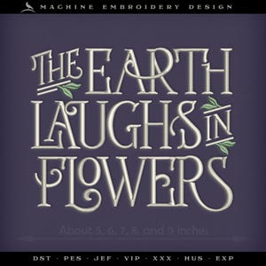 May include: Machine embroidery design with the text "THE EARTH LAUGHS IN FLOWERS" in a decorative font. The design includes green leaf accents and is available in sizes approximately 5, 6, 7, 8, and 9 inches.