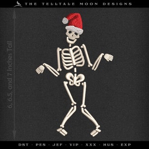 May include: A white skeleton wearing a red Santa hat, standing with its arms outstretched. The skeleton is 6.5, 7, and 6 inches tall. The text "THE TELLTALE MOON DESIGNS" is at the top of the image. The text "DST PES JEF VIP XXX HUS EXP" is at the bottom of the image.
