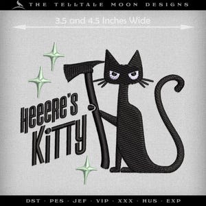 May include: Black cat with angry eyes holding an axe, sitting on a white background with the text "Heeere's Kitty" and four green stars. The image is 3.5 and 4.5 inches wide.