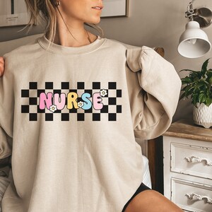 Nurse Sweatshirt, Retro Nurse Sweatshirt, Checkered Nurse Sweatshirt, Nursing Student Gift, Nurse Graduation Gift, Nurse Groovy Flower Shirt