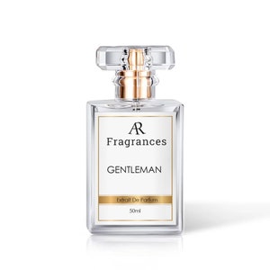 May include: A clear glass bottle of perfume with a gold cap and label. The label reads "AR Fragrances GENTLEMAN Extrait De Parfum 50ml".
