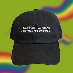 Puede incluir: Una gorra de béisbol negra con texto bordado en blanco que dice "I support womens rights and wrongs".