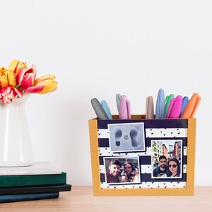 May include: A desk organizer with a navy and white striped design, holding colorful markers. The organizer has three framed photos and is next to a stack of books and a vase of tulips. A tag reads "Instant Digital Download."