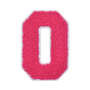 May include: A pink felt letter O with a white outline. The letter is in a varsity style font.