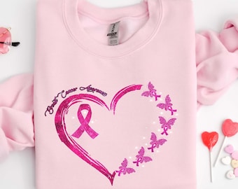 Nastro Della Tenuta Della Donna Fra Le Da Per Consapevolezza Del Cancro Al Seno Image127223736