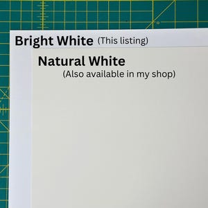 May include: Two pieces of white paper, one labelled "Bright White (This listing)" and the other labelled "Natural White (Also available in my shop)".