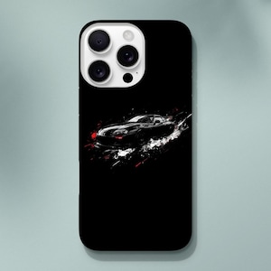 May include: Black phone case with a white image of a sports car on a black background.