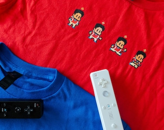 Camiseta infantil Saint Carlo com sprites do videogame