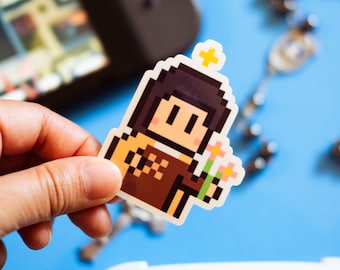 May include: A pixel art sticker of a person with brown hair wearing a brown and yellow outfit and holding a bouquet of flowers. The sticker is on a blue background.