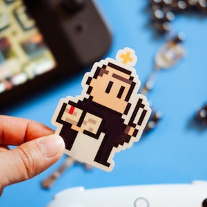 Videojuego de Santo Tomás de Aquino Pegatina