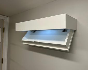Floating box style wall shelf with hidden compartment and magnetic locking system