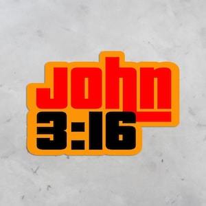 May include: A yellow sticker with the words "John 3:16" in black and red lettering. The word "John" is in red and the numbers "3:16" are in black.