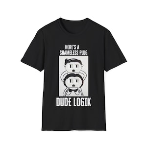 May include: Black t-shirt with a white graphic of two electrical plugs with faces. The text "HERE'S A SHAMELESS PLUG" and "DUDE LOGIK" is printed on the shirt.