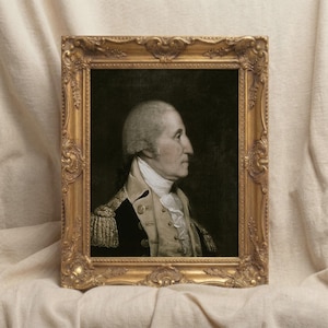 May include: A white ceramic mug with a black handle and the text "But First, Coffee" in a black, handwritten-style font. The mug is on a white surface.