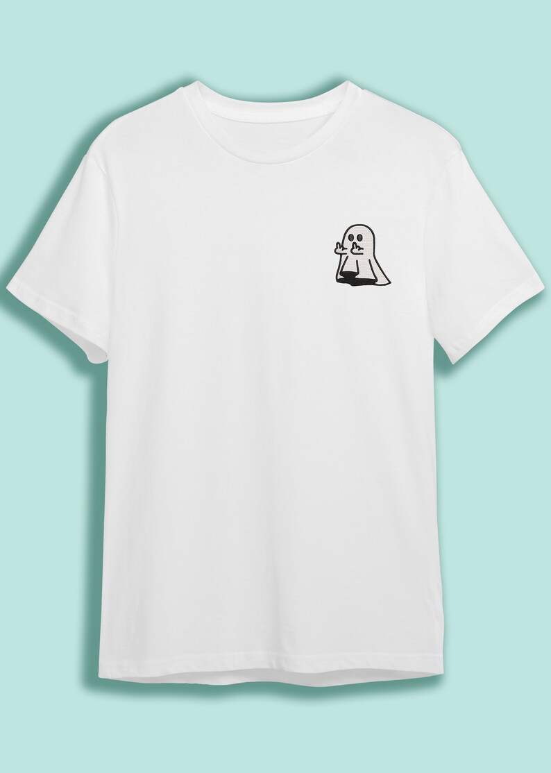 May include: White t-shirt with a black outline of a ghost giving the middle finger.