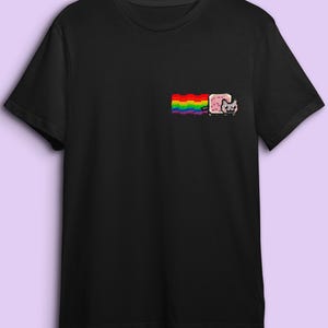 A black t-shirt with a colorful graphic design on the front, including a rainbow and a cat.