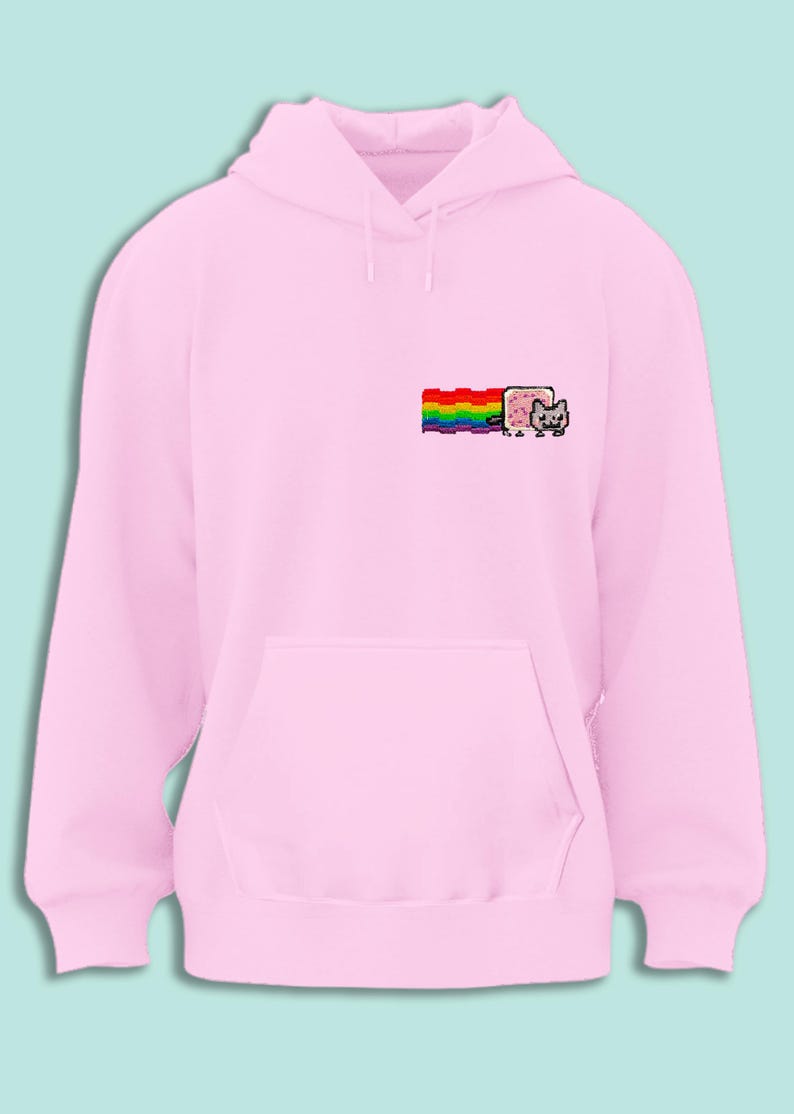 A pink hoodie with a rainbow graphic and a cat graphic on the front.