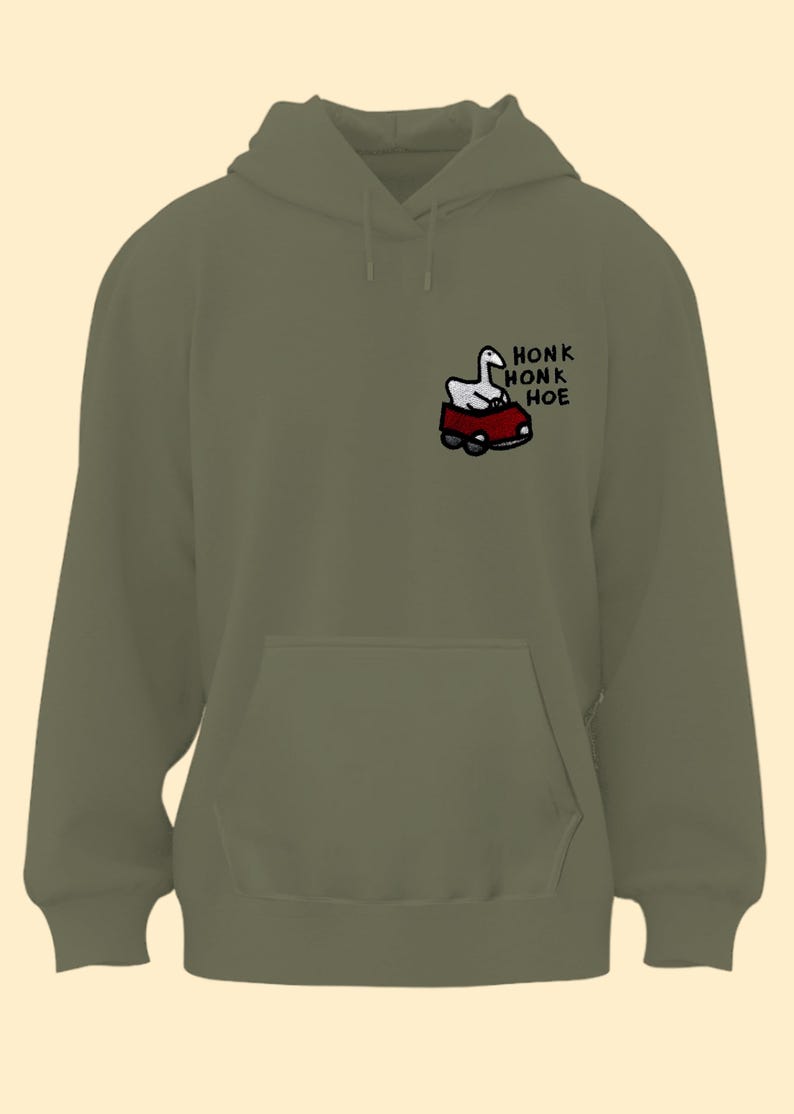 A green hoodie with a graphic of a cartoon goose and the text "Honk Honk Hoe" printed on it.