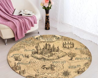 May include: A round, beige rug with a map of Hogwarts and its surroundings. The map features the Hogwarts castle, the Forbidden Forest, Hogsmeade, and the Whomping Willow. The text "Hogwarts & Environs" is printed at the top of the map.