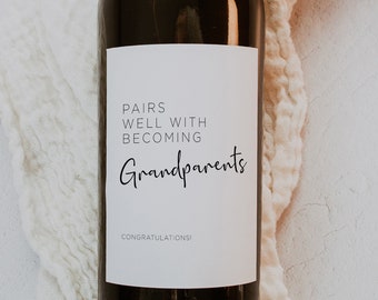 May include: A white wine bottle label with black text that reads "Pairs well with becoming Grandparents. Congratulations!"