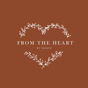 May include: A logo design featuring the text "FROM THE HEART" in a serif font, with "BY SOOZIE" below. The text is centered within a heart-shaped frame of white leaves and vines, set against a brown background.