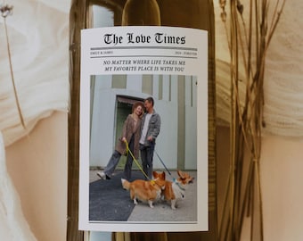 May include: A white wine bottle with a label that reads "The Love Times" with the text "Emily & James" and "2004-Forever" below the title. The label also includes a photo of a couple walking two corgi dogs. The text below the photo reads "No matter where life takes me, my favorite place is with you."