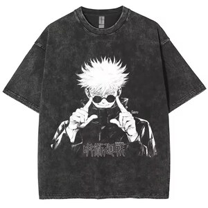 May include: Dark gray t-shirt featuring a white graphic of an anime character with sunglasses, pointing at their eyes. The shirt has the Japanese text "呪術廻戦" and the name "Satoru" printed on it. The shirt has a vintage, washed look.
