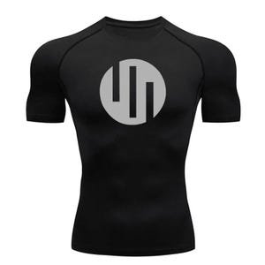 May include: Black short-sleeved compression shirt with a silver circle logo featuring three vertical lines.
