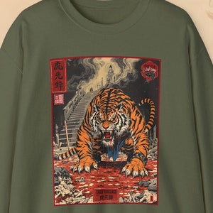 May include: A green sweatshirt with a vintage Japanese woodblock print of a tiger emerging from a bloody scene. The print features the Japanese characters "虎死", which translates to "Tiger Death".