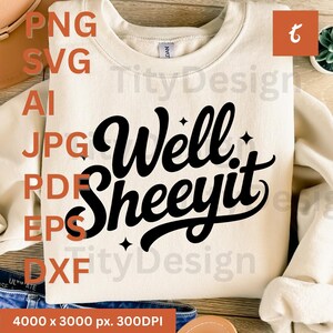 Beige sweatshirt with black “Well Sheeyit” script and sparkles, displayed with hat and jeans, text listing file formats.