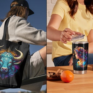 May include: A black tote bag with a colorful illustration of a bull's head. The bull has blue and purple horns and a blue face. The background is black with a colorful design.
