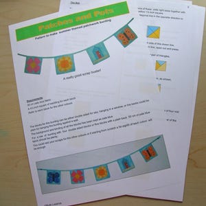 May include: A printed pattern for summer-themed patchwork bunting, featuring colorful square blocks with floral, butterfly, and house designs. The text reads "Patches and Pots" and "A really good scrap buster!"