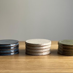 May include: A rustic wooden sign with the text "Welcome to our home" in a handwritten style. The sign has a distressed finish and a simple, inviting design, suitable for a front porch or entryway.