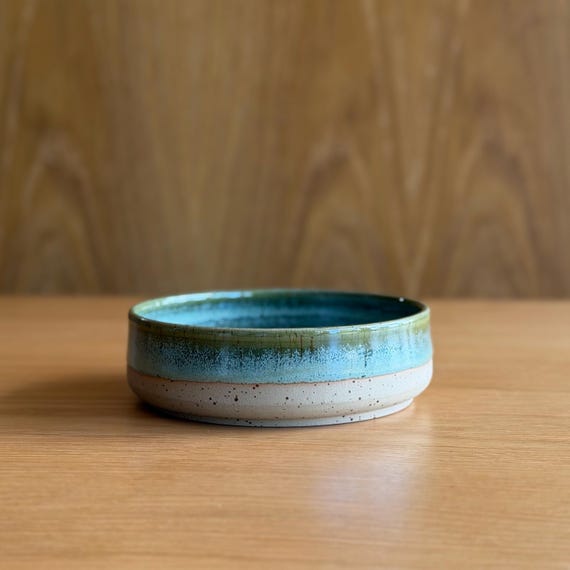 120-favorite UK studio pottery key bowl with a rich green glaze — the kind of tactile, made-by-hand object that makes a plain entryway feel intentional.