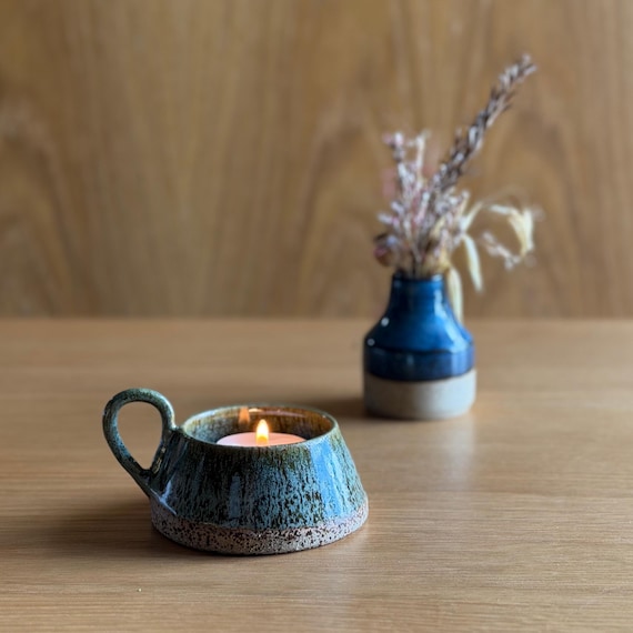 177 favorites don't lie — this rustic wheel-thrown green stoneware candle holder punches well above its $20 price with serious earthy artisan energy.
