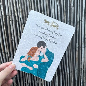 May include: A rectangular card featuring a romantic illustration of a couple embracing, with a horse-drawn carriage and the text "I love you with everything I am, everything I've been, and everything I hope to be."