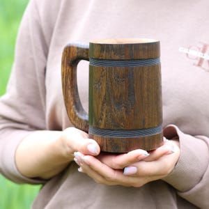 Rustic oak mug on a wooden table, soft light.