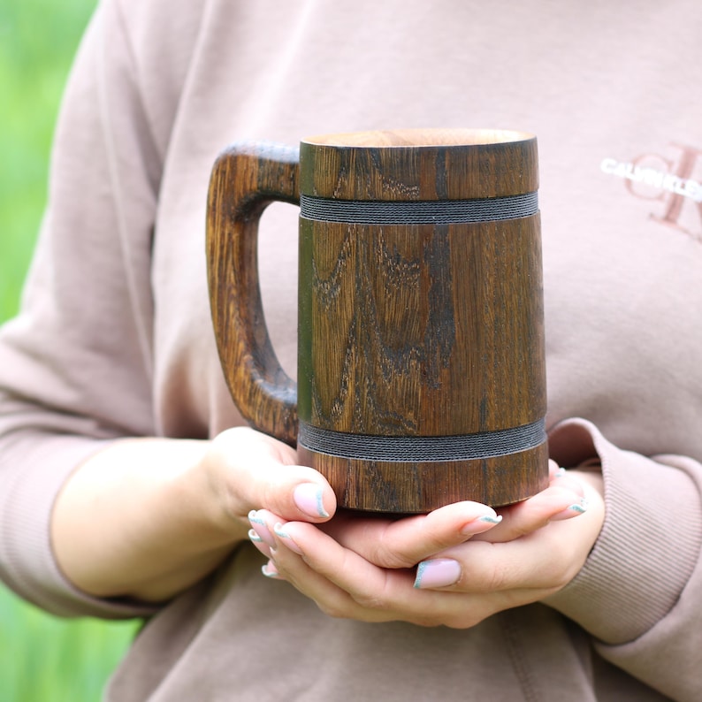 Rustic oak mug on a wooden table, soft light.