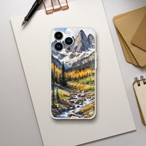 May include: A phone case with a watercolor painting of a mountain range with a river flowing through it. The mountains are snow-capped and the trees are a mix of green and yellow.
