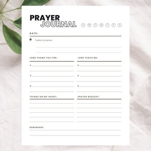 May include: A printable prayer journal with sections for daily scripture, things to be thankful for, prayer requests, and reminders. The journal has a simple black and white design.