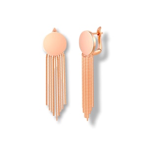 May include: A pair of rose gold earrings with a round disc and a long chain fringe.