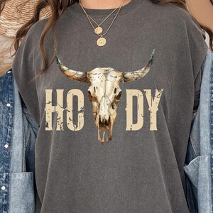 T-shirt graphique Howdy Cowboy : T-shirt unisexe tête de mort de vache, tenue de rodéo western